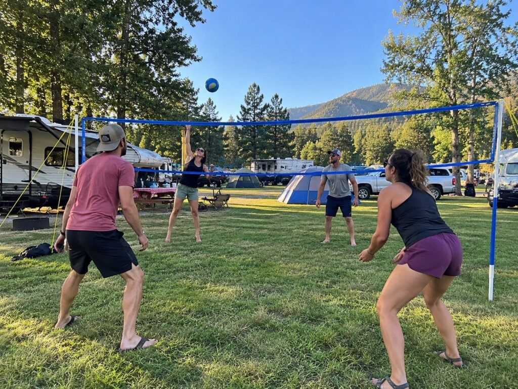4 adults playing Franklin Sports Volleyball