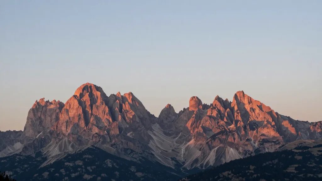 Isolated Dolomites ridge line bathed in soft sunset light, minimal composition