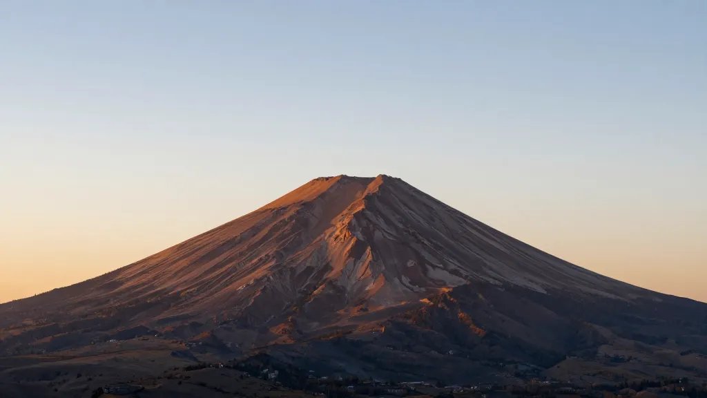 Wide-angle view of a solitary summit overlook bathed in sunrise light