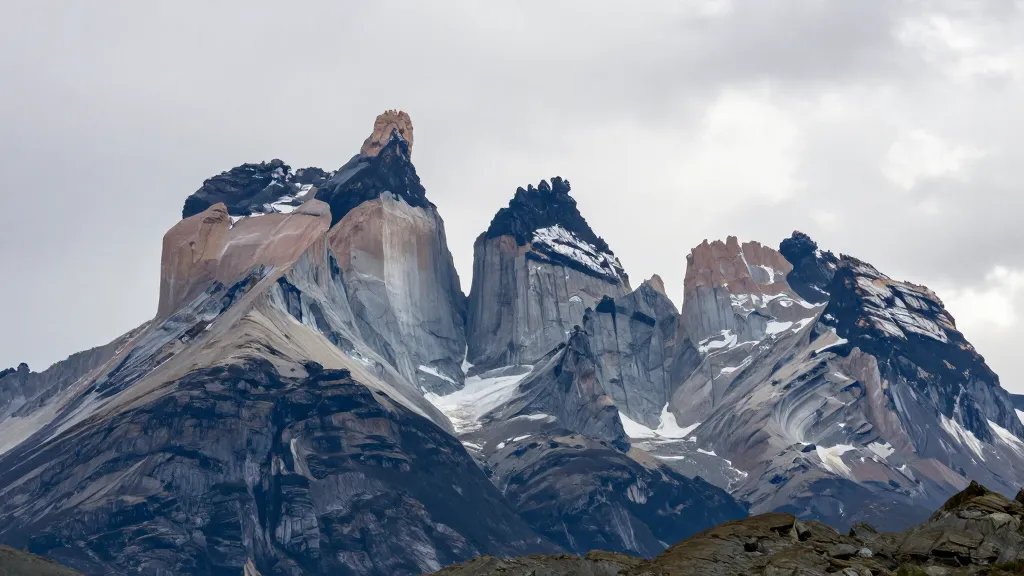 Distant shot of Torres del Paine granite towers under Patagonian skies