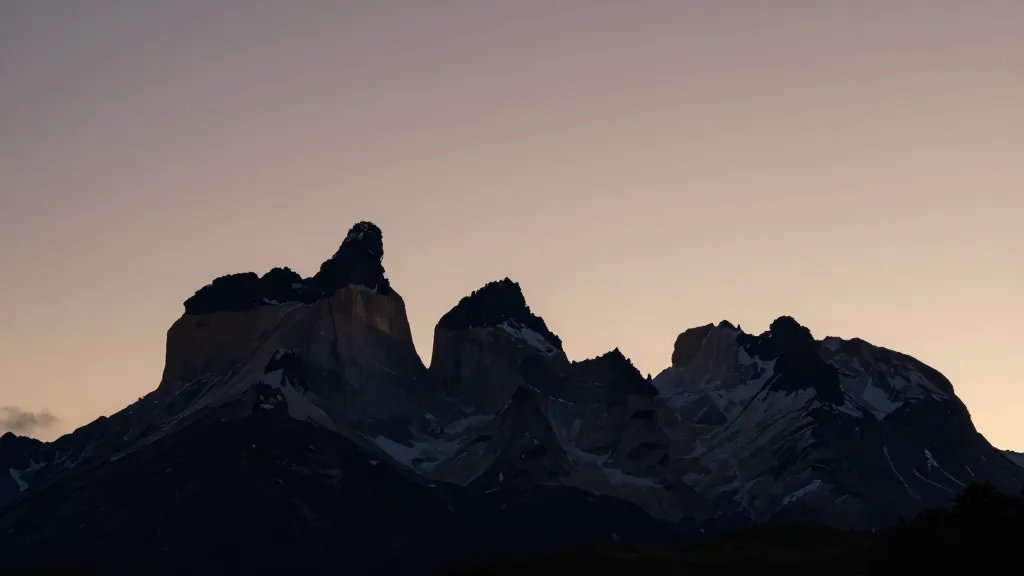 Isolated silhouette of Torres del Paine against Patagonia sky at dawn