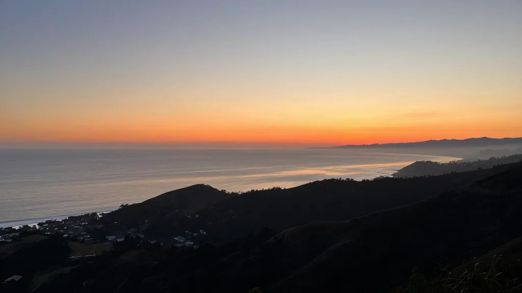 Distant shot of Mount Tamalpais coastal overlook at sunset, sweeping Pacific horizon
