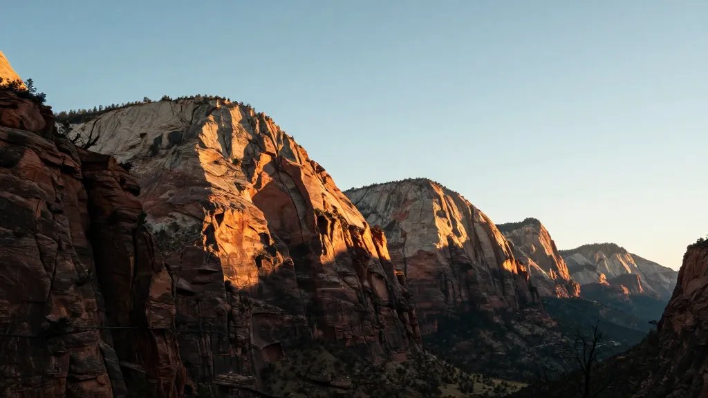 Panoramic cliff-edge with Angels Landing silhouette at golden hour