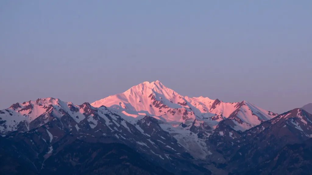 Distant shot of Alpine Ridge Summit with pink dawn peaks