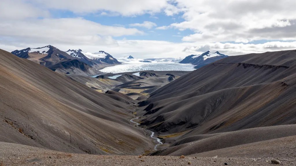 Expansive perspective of Patagonia's wind-sculpted valley and distant glacier lake horizon