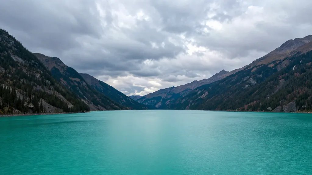 Distant panorama of Emerald Lake basin under dramatic skies