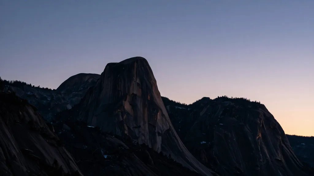 Far-away Ansel Adams Wilderness granite silhouette against twilight sky